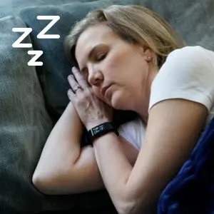lady sleeping wearing Wrist Sync Top 5 Fitness Trackers